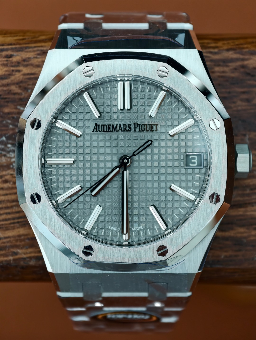 Steel watch with a silver textured dial