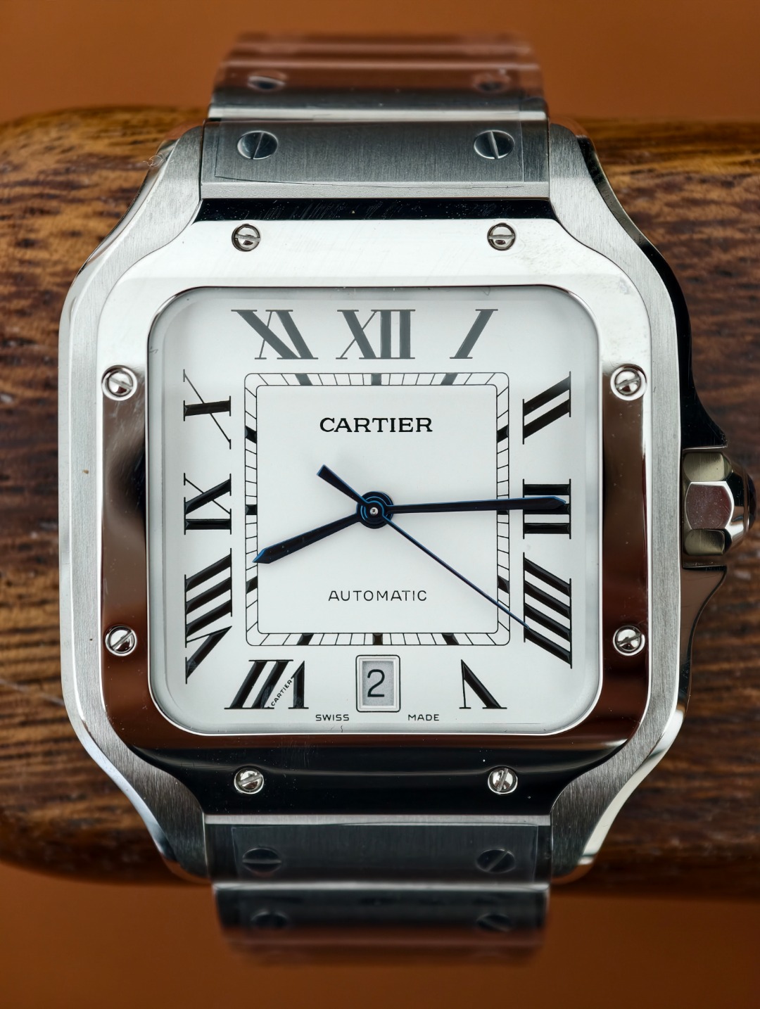 Square steel watch with a white dial